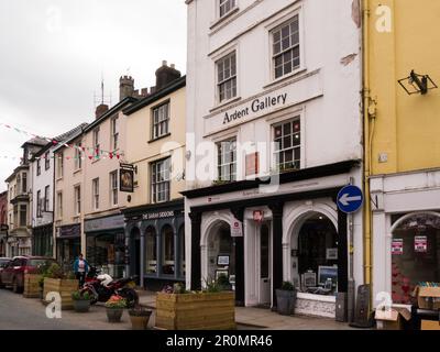 View along High Street with Ardent Gallery and Sarah Siddons public house in this historic market town of Brecon Powys Mid Wales UK Stock Photo