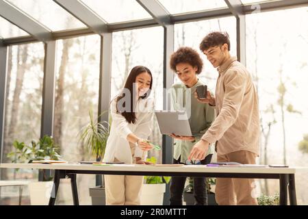 Diverse Colleagues Team Doing Productive Teamwork Using Laptop In Office Stock Photo
