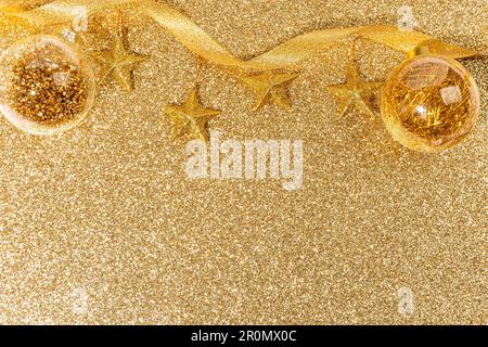 Festive winter tree decorations featuring golden mesh ribbons, glitter  globes, large silk poinsettia flowers, seasonal ornaments for Christmas  tree Stock Photo - Alamy