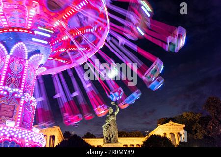 Carousel in front of the Bavaria at night on the Oktoberfest, Munich, Bavaria, Germany Stock Photo