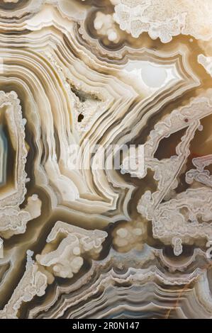 Textured seamless abstract background of ornamental agate onyx stone surface with uneven lines and spots Stock Photo