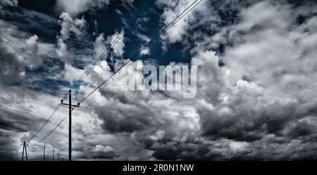 High voltage towers on cloudy sky background before thunderstorm Stock ...