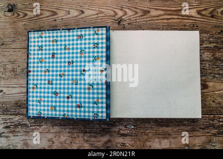 From above view of notebook and nice ornamental placed on wooden board Stock Photo