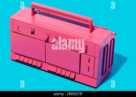 From above of bright pink retro cassette tape recorder placed in studio against blue background Stock Photo