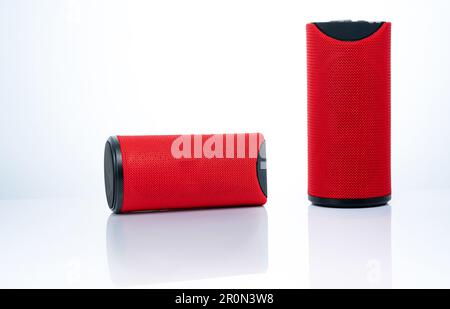 Wireless portable speaker isolated on white background. Red Digital portable speakers. Small sound music box speaker. Modern design mini portable Wire Stock Photo