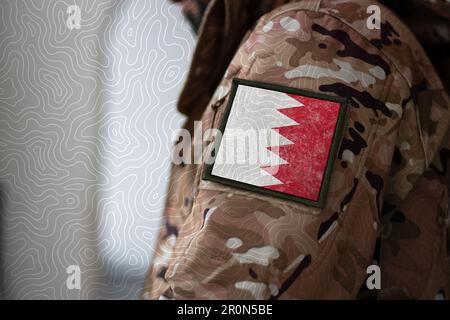 Bahrain Soldier. Soldier with flag Bahrain, Bahrain flag on a military uniform. Camouflage clothing Stock Photo