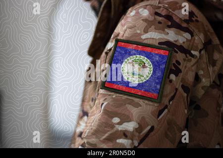 Belize Soldier. Soldier with flag Belize, Belize flag on a military uniform. Camouflage clothing Stock Photo