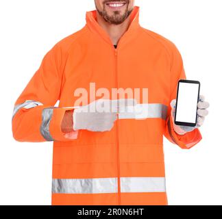 Man in reflective uniform with phone on white background, closeup Stock Photo