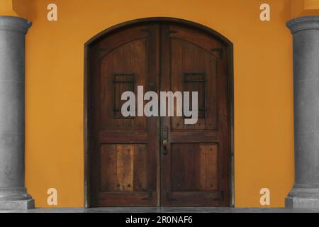 Entrance of house with beautiful old wooden door Stock Photo