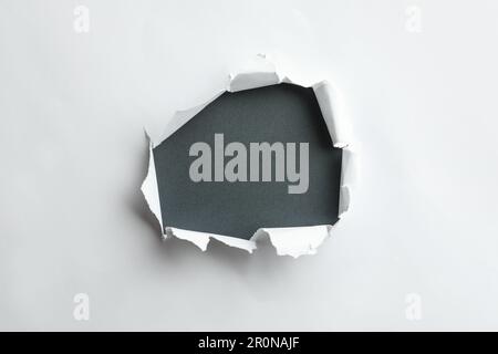 Circle shape hole punch on white background Stock Photo - Alamy