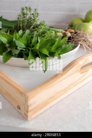 Fresh picked kitchen herbs or garden herbs, Spring onions, mint and thyme Stock Photo