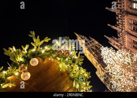 View of the Christmas decoration on the Christkindlmarkt, in the background the Christmas tree and the new town hall, Marienplatz, Munich, Bavaria, Ge Stock Photo