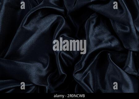 Abstract background black fabric, wavy folds. Texture background Stock Photo