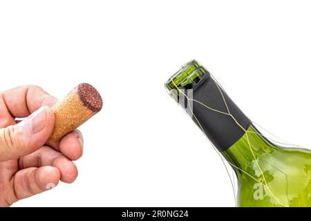 wine bottle isolated against white with hand holding the stopper by the neck of bottle Stock Photo
