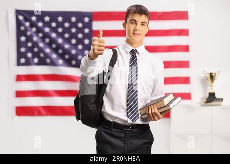 Teenage student showing thumb up Stock Photo - Alamy
