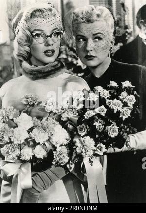 Actresses Marilyn Monroe and Betty Gable in the movie How To Marry a Millionaire, USA 1953 Stock Photo