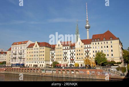 Berlin, Germany: The Nikolai Quarter in central Berlin. This is one of the oldest parts of the city. St Nicholas church and Fernsehtaum behind. Stock Photo