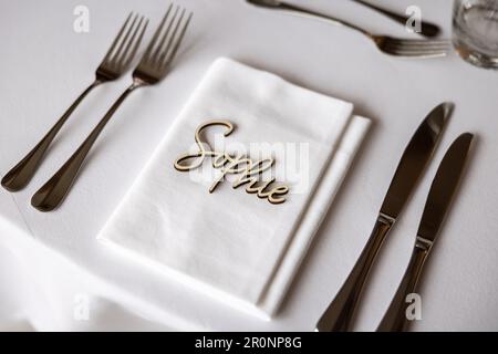Table places with wooden name place cards Sophie Stock Photo