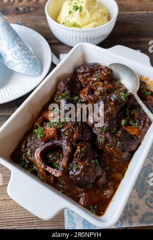 Holiday or sunday meat dish with braised beef shanks or leg slices with gravy Stock Photo