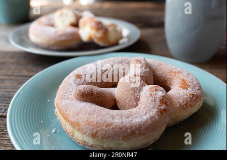 Sweet sugar pretzel. Traditional german yeast pastry or krapfen Stock Photo
