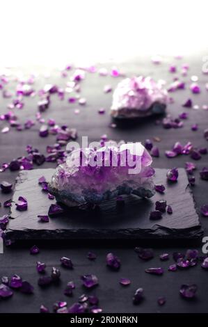 amethyst chips macro detail black background. close-up polished semi-precious gemstone. Stock Photo