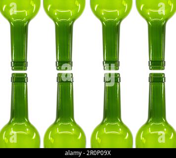 Rows of empty wine bottles isolated on a plain white background. Copy space. Alcohol consumption concept. Stock Photo