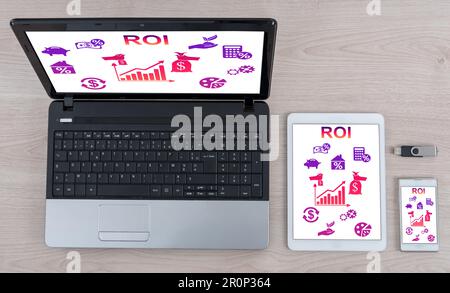 Roi concept shown on different information technology devices Stock Photo