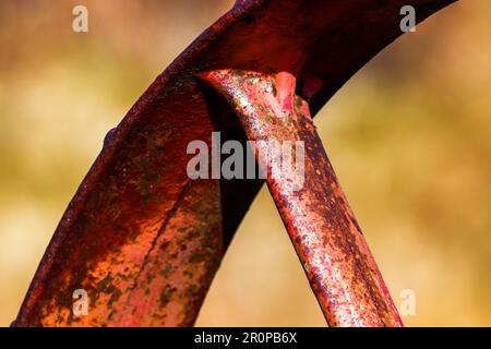 A closeup shot of intricate details on a rust-colored metal surface Stock Photo