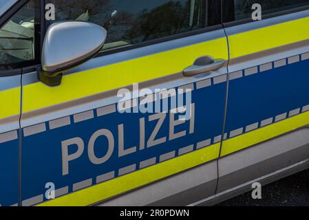 Hamburg, Germany - 04 17 2023: closeup of a door of a german police car with the german inscription police Stock Photo