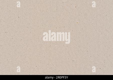 Light brown or beige color cardboard recycled paper, seamless tileable texture, image width 20cm Stock Photo