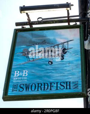 Traditional hanging pub sign at The Swordfish  Inn - Public house - The Strand, Newlyn, Penzance, Cornwall, England  UK Stock Photo