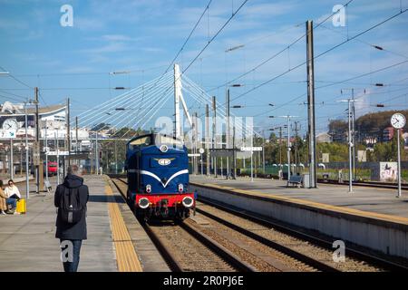 PORTO, PORTUGAL - NOVEMBER 1, 2022 Campanha Train Station with a blue engine just pulling in Stock Photo