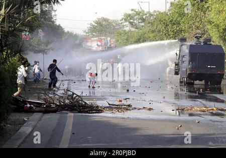 Police officials restore baton charge, fired tear gas shells and used water canon to repel protesters during protest demonstration of Tehreek-e-Insaf (PTI) against the arrest of PTI Chief Imran Khan from the premises of Islamabad High Court, at Mall road in Lahore on Tuesday, May 9, 2023. Stock Photo