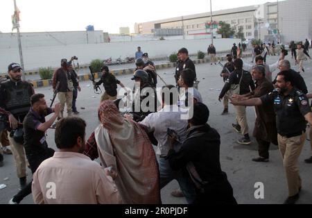 Police officials restore baton charge, fired tear gas shells and used water canon to repel protesters during protest demonstration of Tehreek-e-Insaf (PTI) against the arrest of PTI Chief Imran Khan from the premises of Islamabad High Court, at Airport road in Quetta on Tuesday, May 9, 2023. Stock Photo