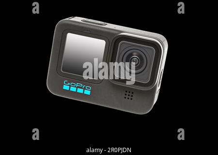 GoPro Hero 11 Black Camera on a black background.  It has a clipping path for putting camera on other backgrounds. Stock Photo