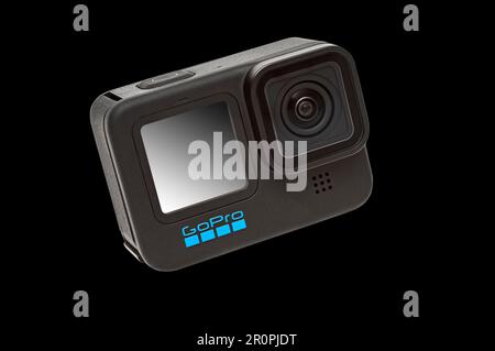 GoPro Hero 11 Black Camera on a black background.  It has a clipping path for putting camera on other backgrounds. Stock Photo