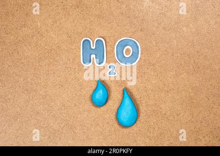 Water drop and H2O symbol, concept of clean water and global care of resources. Environmental topics, hydroelectric energy, drink water resources. Stock Photo