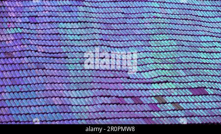 A wavy roof with old tiles. Everything in good condition. The color of the shingles is changed to blue to created a gradient blue background Stock Photo