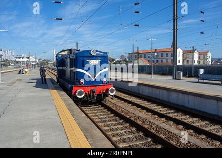 PORTO, PORTUGAL - NOVEMBER 1, 2022 Campanha Train Station with a blue engine just pulling in Stock Photo