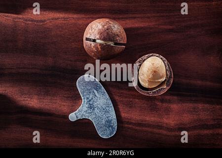 Macadamia Nuts On Vintage Wooden Board Stock Photo