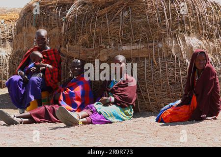 Maasai woman, hut, children, Tanzania Stock Photo