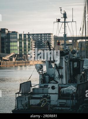 View of ship and buildings at canal against sky Stock Photo