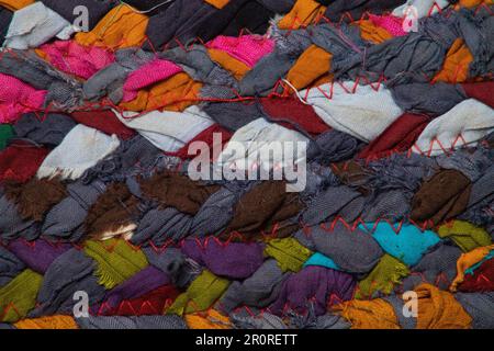 close up handmade recycled fabric rug, colorful rows, rag rug, woven colors, proddy, hooky, proggie, clootie mat Stock Photo