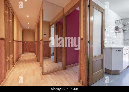 Distributor of a house with a hallway with closets and access doors to various rooms Stock Photo