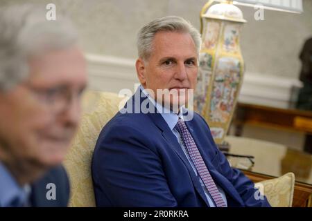 Washington DC, USA. 09th May, 2023. Speaker of the United States House of Representatives Kevin McCarthy (Republican of California), looks on while meeting with US House Minority Leader Hakeem Jeffries (Democrat of New York), US Senate Majority Leader Chuck Schumer (Democrat of New York), and US Senate Minority Leader Mitch McConnell (Republican of Kentucky), in the Oval Office of the White House to discuss the debt limit with US President Joe Biden in Washington, DC on Tuesday, May 9, 2023. Credit: MediaPunch Inc/Alamy Live News Stock Photo