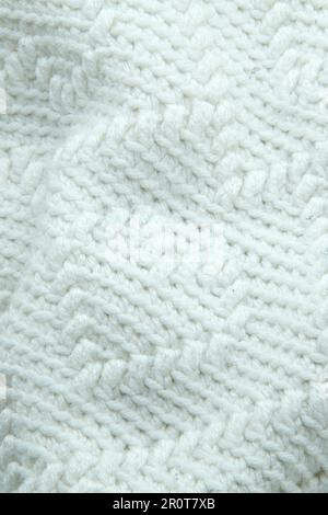 white crocheted or knitted blanket with a heart pattern Stock Photo