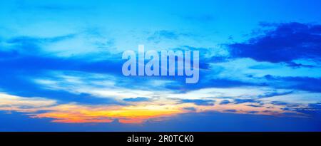 Beautiful sunset panoramic view, morning sunrise wide panorama, blue sky, colorful red pink orange yellow cloud, dawn cloudy skies background, sundown Stock Photo