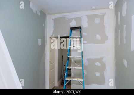 During process of being plastered with drywall newly constructed house is ready for painting after being plastered drywall Stock Photo