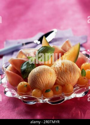 Melon sorbet and parma ham Stock Photo