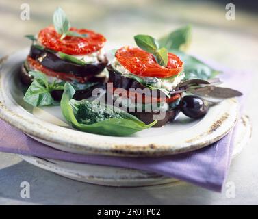 Eggplant, tomato and mozzarella Mille-feuille with pistou Stock Photo